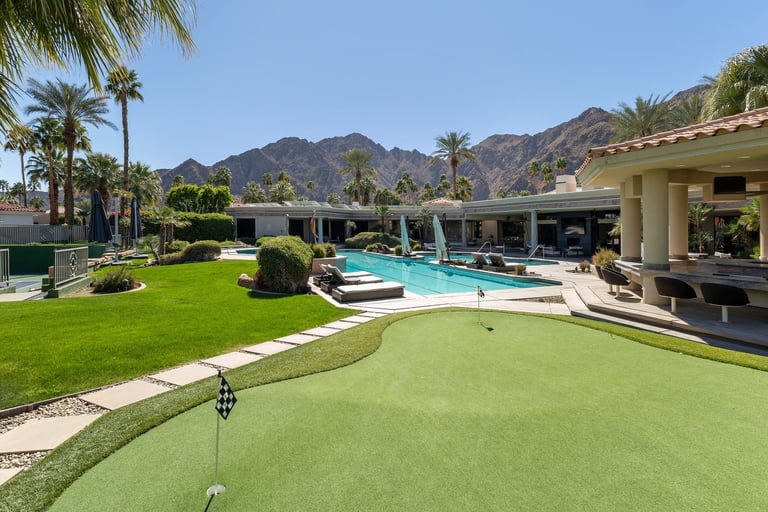 Luxury estate putting green with pool
